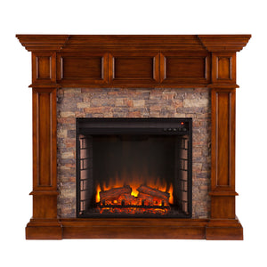 Corner-convertible electric fireplace with faux stone surround Image 3