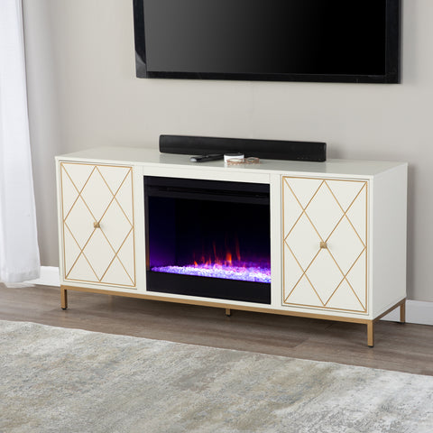Image of Color changing media fireplace with modern gold accents Image 1
