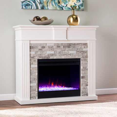 Image of Color changing electric fireplace w/ modern faux stone surround Image 1