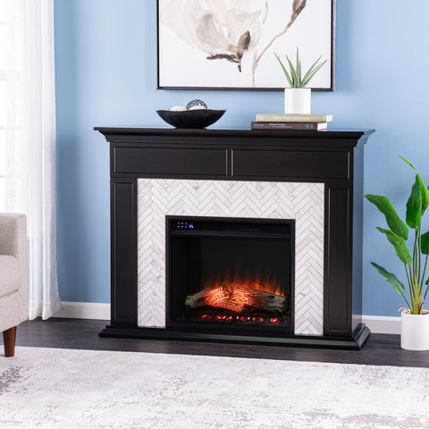 Image of Fireplace mantel w/ authentic marble surround in eye-catching herringbone layout Image 1