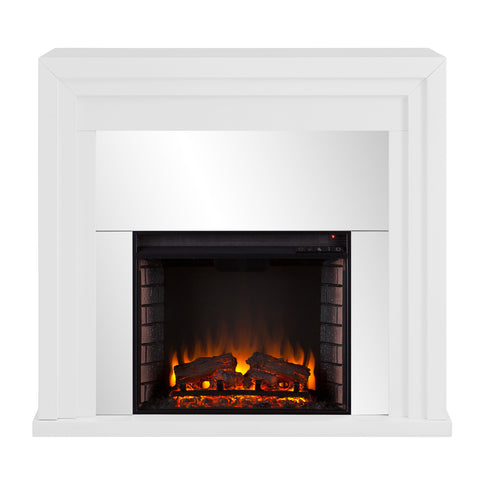 Image of Mixed material fireplace mantel w/ mirrored surround Image 3