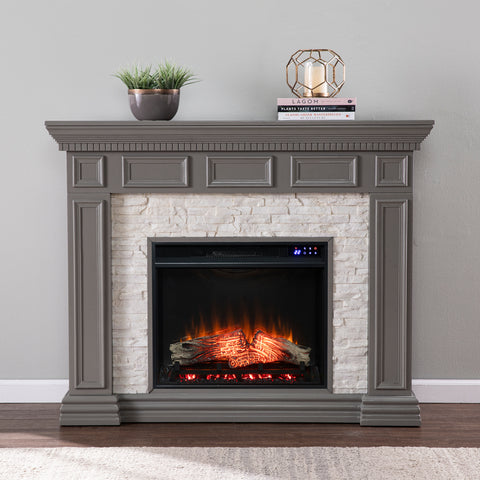 Image of Classic electric fireplace w/ stacked faux stone surround Image 1