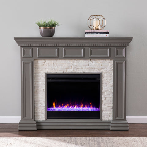 Image of Electric fireplace w/ color changing flames and faux stone surround Image 1