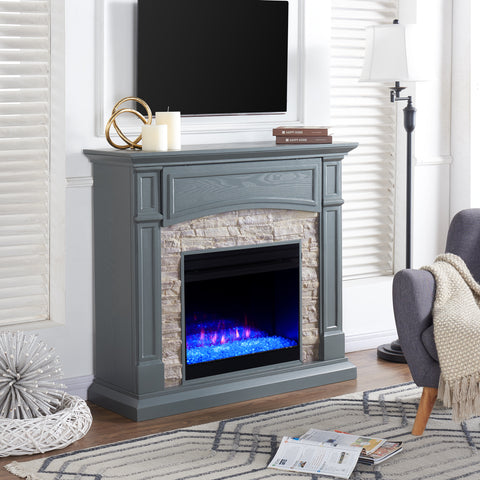 Image of Color changing fireplace w/ stacked faux stone surround Image 3