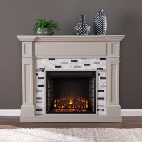 Image of Classic electric fireplace with multicolor marble surround Image 1
