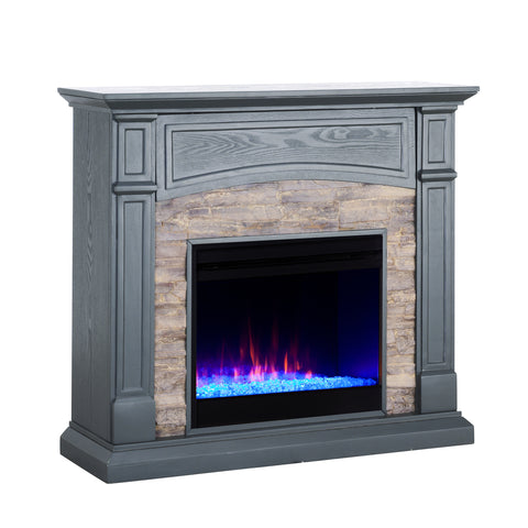 Image of Color changing fireplace w/ stacked faux stone surround Image 5