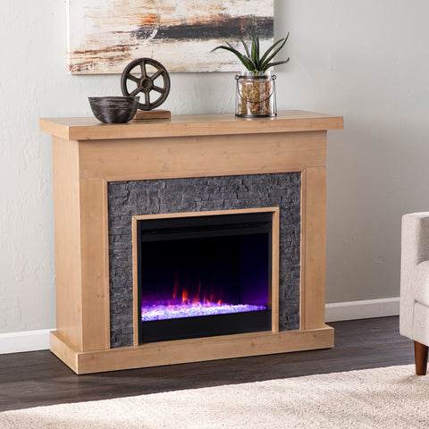 Image of Color changing fireplace w/ faux stone surround Image 1