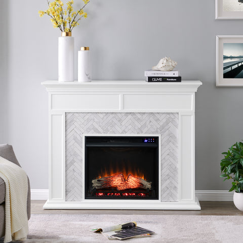 Image of Fireplace mantel w/ authentic marble surround in eye-catching herringbone layout Image 1
