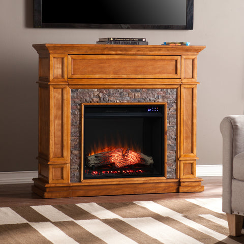 Image of Electric fireplace w/ faux river stone surround Image 1