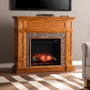 Electric fireplace w/ faux river stone surround Image 1