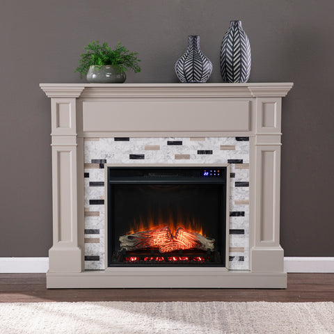 Image of Classic electric fireplace with multicolor marble surround Image 1