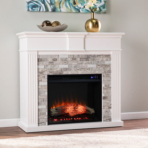 Image of Classic electric fireplace w/ modern faux stone surround Image 1