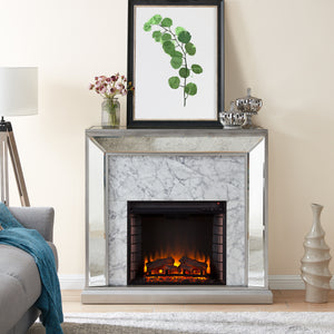 Elegant mirrored fireplace mantel w/ faux stone surround Image 1