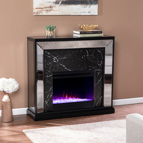 Image of Elegant mirrored fireplace mantel w/ faux stone surround Image 1