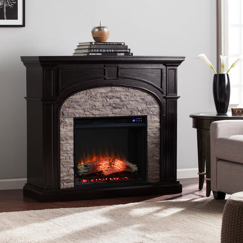 Image of Electric fireplace w/ stacked stone surround Image 1