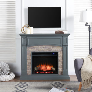Electric fireplace w/ faux stone surround Image 1