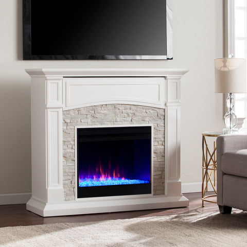 Image of Color changing fireplace w/ stacked faux stone surround Image 1